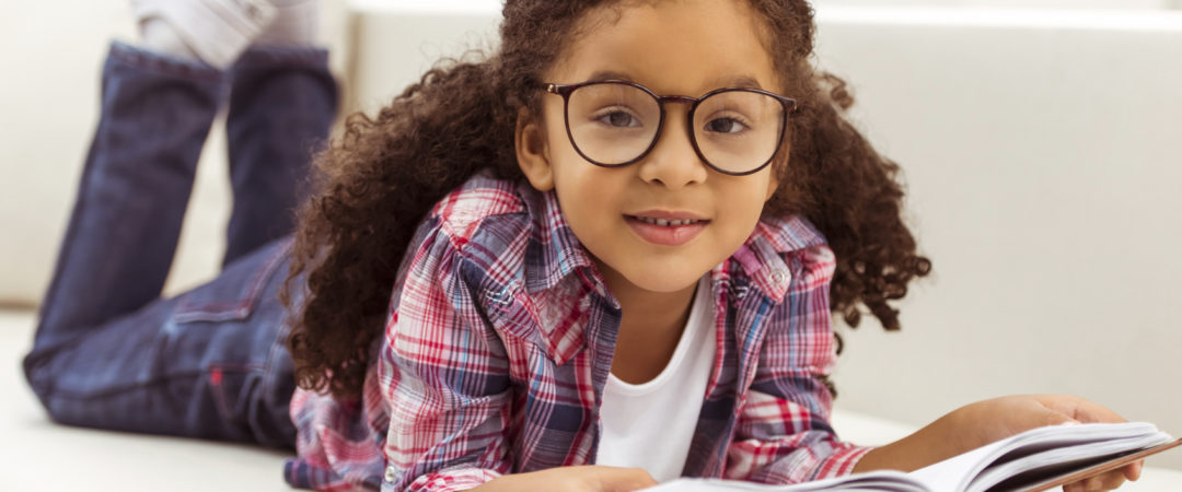 girl with glasses reading